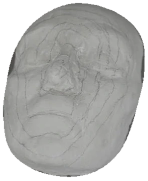 A solid pale face cast with hand-drawn guides, isolated from the studio table.